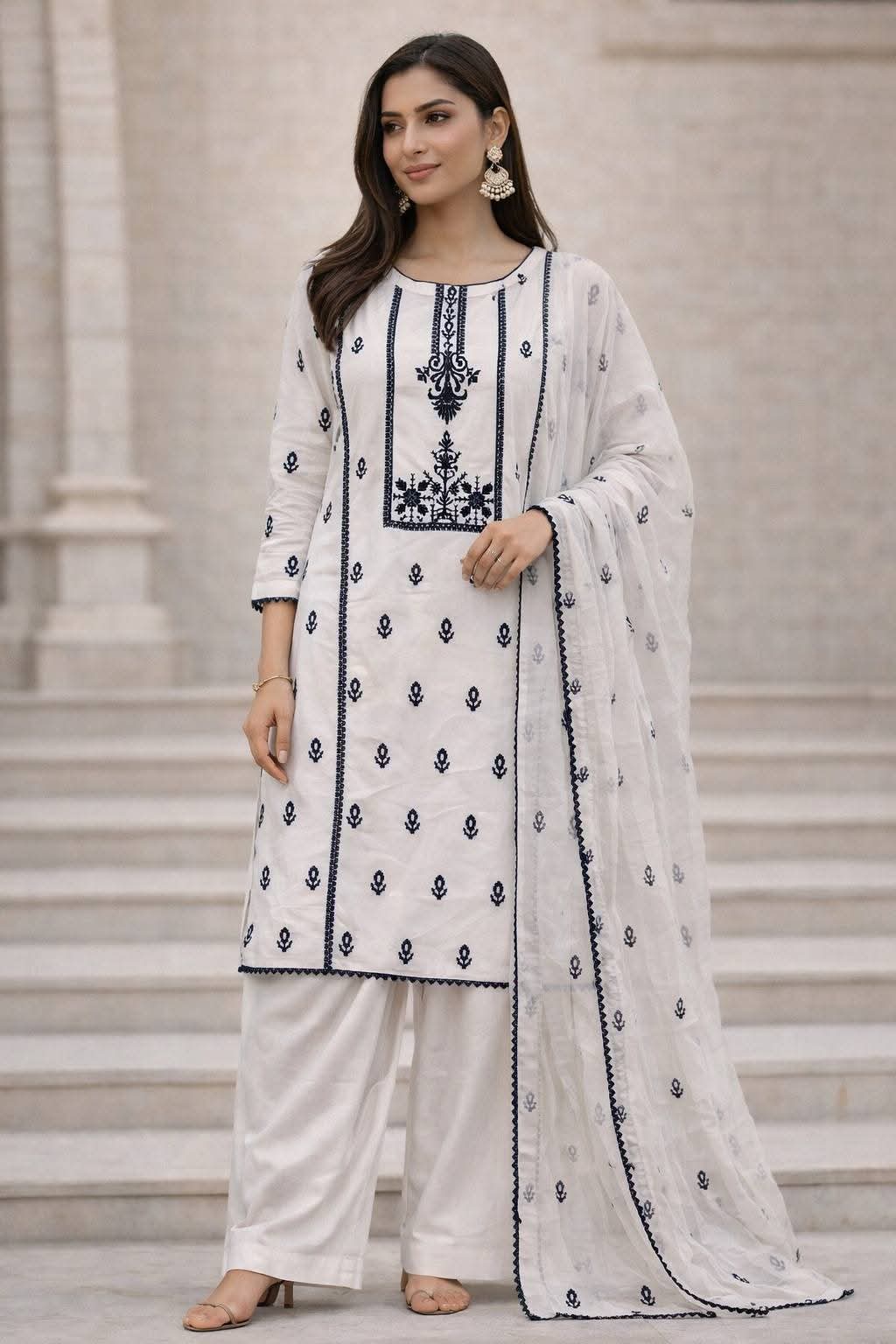 Off-white lawn straight shirt styled with striking navy blue