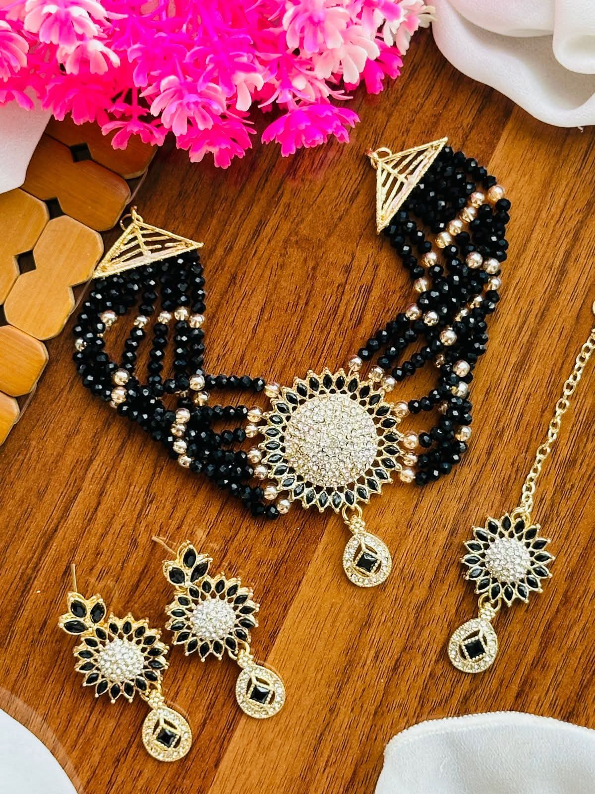 Black Beaded Multi-Strand Choker Set with Floral Circular Centerpiece, Drop Earrings, and Maangtikka