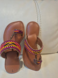 Traditional multi-color embroidered Kolhapuri flat sandal.