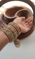 Gold-Toned Cubic Zirconia Bangle Set with Hanging Jhumki Charm