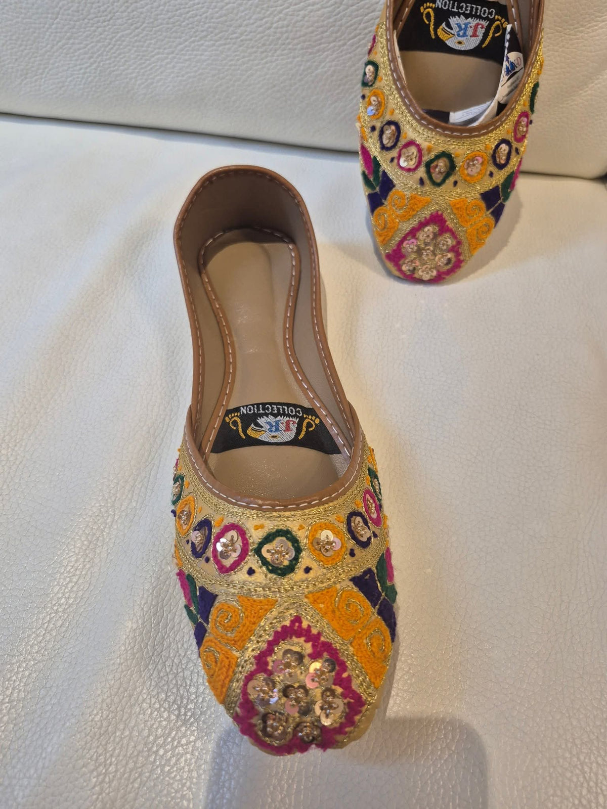 Bright yellow khussa with colourful embroidery