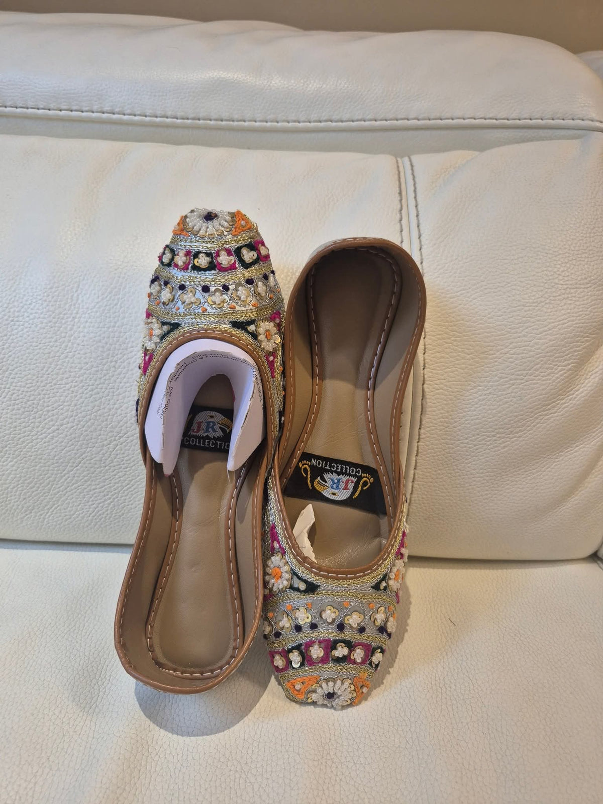 Multi-color thread and mirror-work khussa.